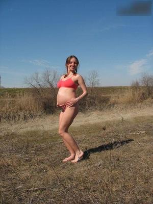 [Pregnant] young girl proud to show off her belly