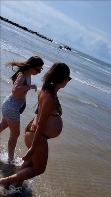 Pregnant italian mom at beach